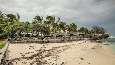 A tourist is seen on the beachfront in Blue Bay, Pointe d'Esny, Mauritius. AFP