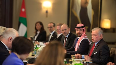 King Abdullah II of Jordan and his son Crown Prince Hussein bin Abdullah, second right, hold talks with a European Union delegation at Al Husseiniya Palace in Amman on Thursday. Getty Images