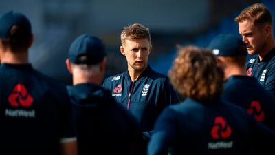 England captain Joe Root talks to his players. AFP