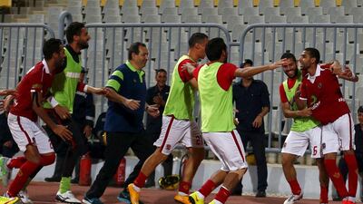 Al Ahly players celebrate during their Cairo derby victory over Zamalek on Tuesday in a spectator-less match in Alexandria due to security concerns. Amr Abdallah Dalsh / Reuters