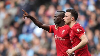 Sadio Mane celebrates scoring their second goal with Diogo Jota. Action Images