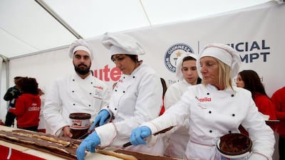 Italy and France work together at Expo 2015 in an attempt to create the world’s longest baguette. To certify the achievement of the record a jury of the Guinness Book of World Records measured the Nutella chocolate creme baguette with a total length with 122.40 meters. It was cut into more than 2,400 slices and distributed to visitors of the exhibition. Mourad Balti Touati / EPA