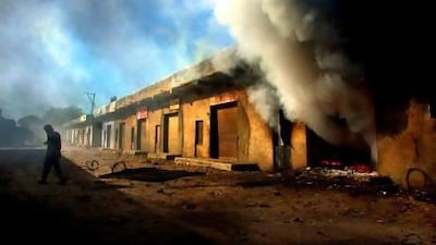 A fire burns in a warehouse in the village of Aslalinaka during Hindu Muslim riots in India in March, 2002. Mr Modi’s alleged association with the riots may prove problematic in the 2014 general elections.