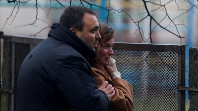 Onlookers at the site of the crash. Reuters
