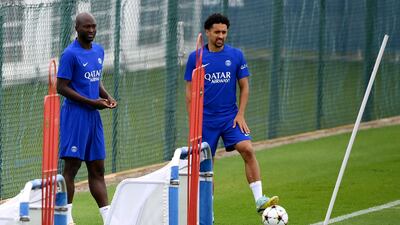 Midfielder Danilo Pereira, left, and defender Marquinhos take part in a training session. AFP