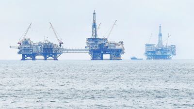 Drilling platforms are seen off the southern California coast. Opec also revised lower liquids supply this year from countries outside of its group. Non-Opec supply growth has been revised by 300,000 bpd to reach 700,000 bpd for 2021. AFP