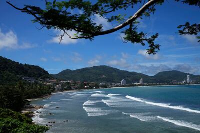 Waves break on the empty tourist beach of Patong on Phuket, southern Thailand. AP