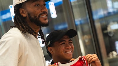 Derrick Rose meets a Chicago Bulls fan. Rose was drafted by the Bulls in the 2008 NBA Draft. Photo: NBA