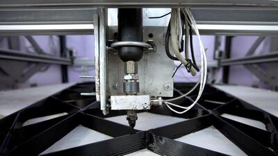 A 3D printer constructs the building blocks for a canal house in Amsterdam. Peter Dejong / AP Photo