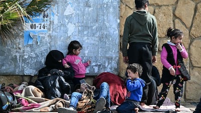 Residents shelter along Beirut's corniche after fleeing the southern suburbs. AFP