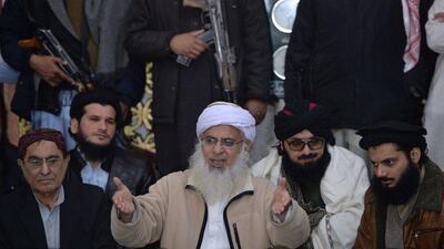 Chief imam of Islamabad’s Red Mosque Maulana Abdul Aziz, centre, speaks during a press conference in Islamabad. Hardliners like Aziz have been muzzled, analysts say, but extremism still bubbling beneath society’s surface. Aamir Quereshi / AFP Photo