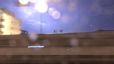 Lightning strikes over Abu Dhabi on Sunday. Charles Capel / The National