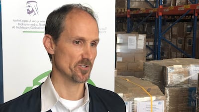 WHO team leader Robert Blanchard supervises the shipment on Monday. Nick Webster / The National