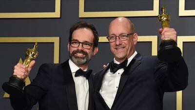 Andrew Buckland, left, and Michael McCusker, winners of the award for best film editing for "Ford v Ferrari", at the 92nd Academy Awards on Sunday, February 9. AP