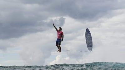Brazil's Gabriel Medina reacts after riding a large wave in the fifth heat of the third round of men's surfing at the Paris Olympics, in Teahupo'o, Tahiti. AFP