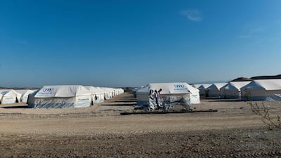 Migrants are seen at Nea Kavala camp, near the city of Kilkis, northern Greece. Some 1000 refugees and migrants were transferred from the Greek island of Lesbos to the Nea Kavala camp under a decision taken by the Greek government at an emergency meeting on August 31. AFP