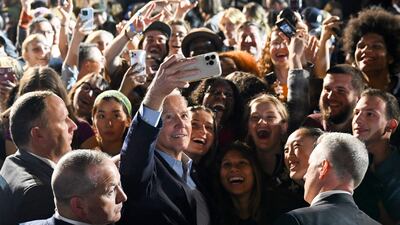 US President Joe Biden, centre, poses for a selfie with supporters during a rally for Democratic candidates, including New York Governor Kathy Hochul, at Sarah Lawrence College in Bronxville, New York. AFP