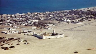 This aerial photograph was taken in 1964, the year oil was first exported by Abu Dhabi. The town is expanding around Qasr Al Hosn, with many more modern concrete buildings, especially along the shoreline. Rene Burri / Magnum Photos