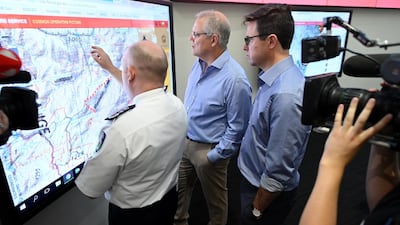 Australian Prime Minister Scott Morrison listens to New South Wales Rural Fire Service Commissioner Shane Fitzsimmons during a tour of the NSW RFS control room in Sydney, Australia, 22 December 2019. EPA