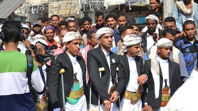 Twenty grooms celebrate their weddings in Jamal Street, central Taez, on February 4, 2016. Tareq Al Mallah for The National