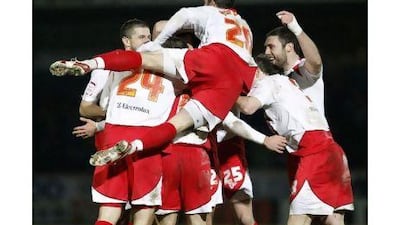Stevenage players celebrate Stacy Long's goal. Darren Staples / Reuters