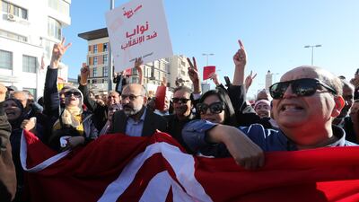 Protesters shout slogans during the demonstration. EPA