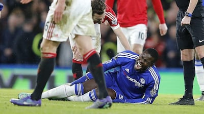 Kurt Zouma reacts in pain after sustaining the injury in Chelsea's Premier League draw with Manchester United. Frank Augstein / AP Photo