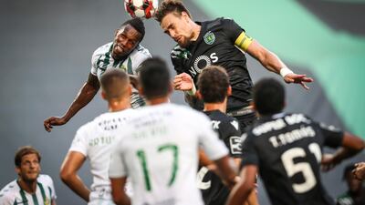 Sporting player Sebastian Coates, right, vies for the ball with Vitoria de Setubal player Semedo during the Portuguese First League match Sporting vs Vitoria de Setubal held at Alvalade Stadium, in Lisbon, Portugal. EPA