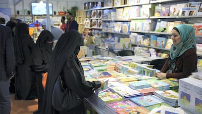 Visitors take a look at the books during the Sharjah International Book Fair at the Sharjah Expo Centre in Sharjah. Satish Kumar for the National