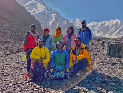 Zabih Afzali, pictured front middle, surrounded by friends at the base camp of Mount Noshakh, 2020. Courtesy Zabih Afzali