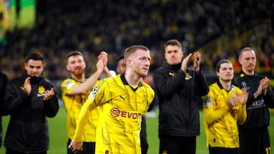Marco Reus leads the team in applauding the fans after the victory over PSV. Reuters