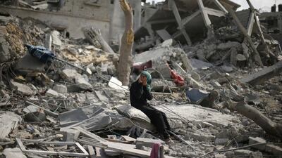 A Palestinian woman reacts as she sits on the rubble of her destroyed house after returning to Beit Hanoun town, which witnesses said was heavily hit by Israeli shelling and air strikes during the Israeli offensive. Suhaib Salem / Reuters