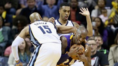 Los Angeles Lakers' Kobe Bryant, right, has a field-goal percentage that is cratering at 37.2 per cent while he takes 22 shots per game, almost twice as many as any teammate. Andy Lyons/Getty Images