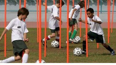 Children during a training soccer session with Chelsea footballer at Zayed sport city.