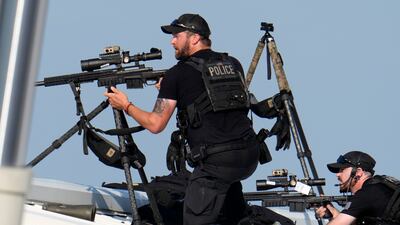 Police snipers return fire after shots were fired at Republican presidential candidate Donald Trump in Butler, Pennsylvania, on Saturday. AP