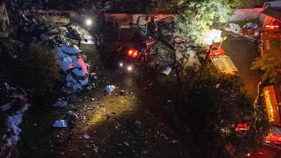 Firefighters at the site where the French-made ATR 72-500 plane operated by the airline Voepass crashed. AFP