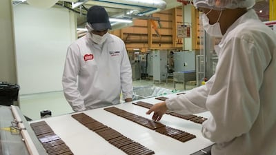 Employees checks for defects before the bars go to packaging. While machines have done most of the work up until this point, humans are now needed. There are about 300 employees working in the plant, running three shifts over 24 hours.