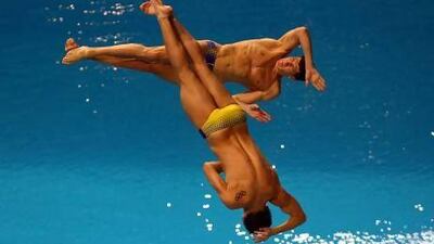 Kvasha Illya and Prygorov Oleksiy of Ukarine , eventual winners of the silver medal of the Men's 3m Springboard Synchro event, show how the sport is artistic and extreme as well. Satish Kumar / The National