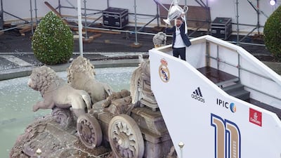 Captain Sergio Ramos of Real Madrid holds the trophy as he celebrates with his team and fans at Cibeles square after winning the Uefa Champions League Final match against Club Atletico de Madrid on May 29, 2016 in Madrid, Spain. (Photo by Pablo Blazquez Dominguez/Getty Images)