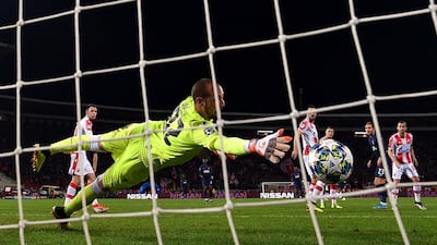 Red Star goalkeeper Milan Borjan cannot stop Christian Eriksen's shot making the score 4-0. Reuters