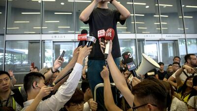 Pro-democracy activist Joshua Wong talks to the media after being released from prison, outside the Legislative Council building, in Hong Kong, China, 17 June 2019. EPA