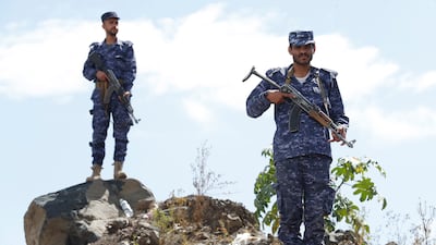 Yemeni soldiers stand guard during a ceremony. Iran-backed Houthi rebels fighting the internationally recognised government have been accused of committing atrocities in the country's conflict. EPA