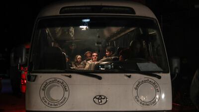 A Syrian Arab Red Crescent bus is loaded with patients who are to be transferred to Damascus. Mohammed Badra / EPA