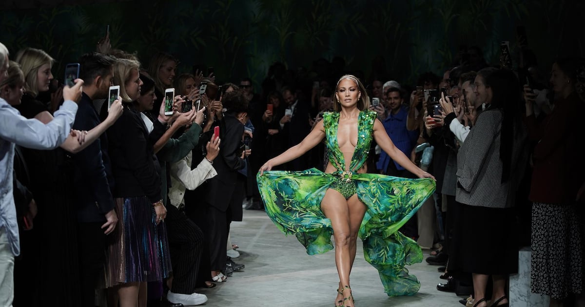 Jennifer Lopez walks for Versace in famous jungle-print green dress from 2000 at Milan Fashion Week | The National Jennifer Lopez walks for Versace in famous jungle-print green dress from 2000 at Milan Fashion Week | The National