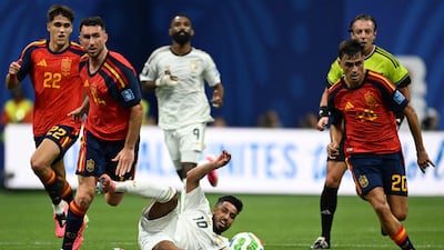 Saudi Arabia's Salem Al Dawsari fights for the ball with Spain's Aymeric Laporte. AFP