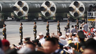 Military vehicles carrying the DF-5B intercontinental ballistic missile roll past Tiananmen Square. EPA