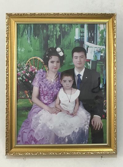 A family portrait taken after the husband graduated from a vocational training centre in early 2019. The family celebrated his graduation with a party and hung the portrait in their living room