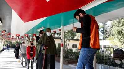 People wait to cast their votes during parliamentary elections in Amman. Reuters