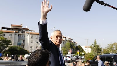 Retired Israeli general Benny Gantz, one of the leaders of the Blue and White political alliance, waves after casting his vote during Israel's parliamentary elections. AFP