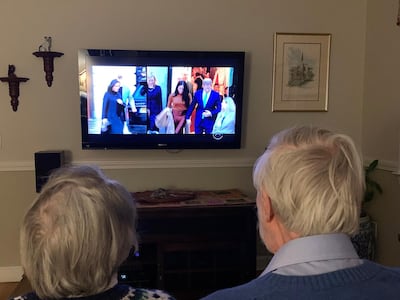 A couple watch Oprah Winfrey interview Harry and Meghan, Duke and Duchess of Sussex. EPA